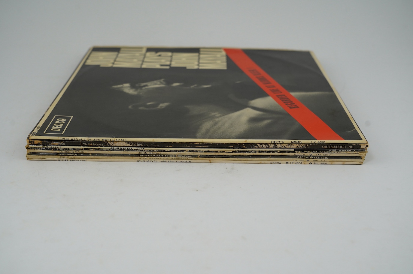 Eight John Mayall LP record albums; John Mayall Plays John Mayall Live at Klooks Kleek on Decca LK.4680, A Banquet in Blues, Live, Thru the Years, Looking Back, Barewires, Crusade, Blues Breakers. Condition - fair